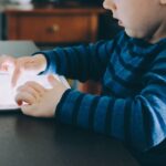 young child with iPad