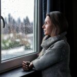 woman looking at a dreary winter day