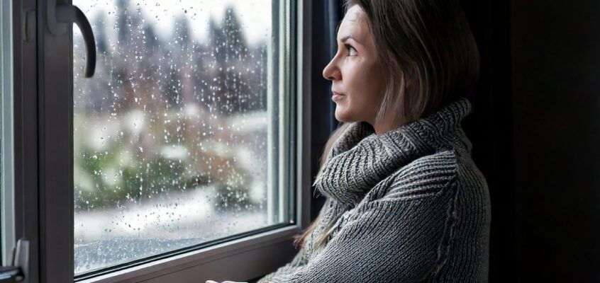 woman looking at a dreary winter day