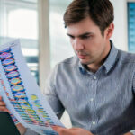 man reading genetics report landscape