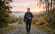 man walking at sunrise
