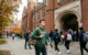 college student approaching building